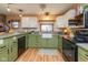 Charming kitchen features stylish cabinets, farmhouse sink, and modern appliances at 218 Miami Dr, Noblesville, IN 46062