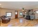 Comfortable living room showcasing hardwood floors, a stone fireplace, and a cozy armchair at 218 Miami Dr, Noblesville, IN 46062