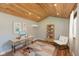 Stylish home office with wood-paneled ceiling, contemporary desk, and ample natural light for a productive workspace at 218 Miami Dr, Noblesville, IN 46062