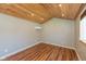Spacious room with light gray walls, wood-paneled ceiling, and modern climate control unit, suitable for versatile use at 218 Miami Dr, Noblesville, IN 46062