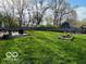 Expansive backyard featuring a well-maintained lawn, patio area, perfect for outdoor entertaining and relaxation at 2335 Durham Dr, Indianapolis, IN 46220