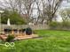 Backyard deck and lawn, complete with outdoor seating and a grill, perfect for entertaining at 2335 Durham Dr, Indianapolis, IN 46220