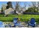 Backyard with outdoor seating and a large lawn, ideal for recreation and enjoying the outdoors at 2335 Durham Dr, Indianapolis, IN 46220