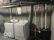 Unfinished basement with two newer model washing machines and utility infrastructure at 2335 Durham Dr, Indianapolis, IN 46220
