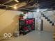 Unfinished basement for storage with shelves, water heater, and staircase at 2335 Durham Dr, Indianapolis, IN 46220