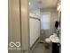 Clean bathroom featuring white shower curtain and cabinet sink at 2335 Durham Dr, Indianapolis, IN 46220