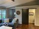 Comfortable living room with a cozy blue sofa and a modern barn door at 2335 Durham Dr, Indianapolis, IN 46220