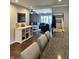 Inviting living room with stylish bar cabinet, opening into a cozy seating area with a large sectional sofa at 2335 Durham Dr, Indianapolis, IN 46220