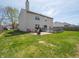 Sprawling backyard with a deck, patio, and lush lawn, ideal for outdoor activities at 270 Lazy Hollow Dr, Brownsburg, IN 46112