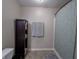 Neutral bathroom with shower featuring a patterned curtain and grey bath mat at 270 Lazy Hollow Dr, Brownsburg, IN 46112