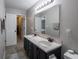 This bathroom features double sinks, marble countertops, and tiled flooring at 270 Lazy Hollow Dr, Brownsburg, IN 46112