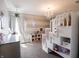bedroom with white bunk beds, a chandelier, and neutral striped walls at 270 Lazy Hollow Dr, Brownsburg, IN 46112