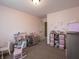 This bedroom has pink walls with plenty of room to play and learn at 270 Lazy Hollow Dr, Brownsburg, IN 46112