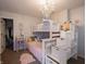 bedroom with white bunk beds, a chandelier, and carpeted flooring at 270 Lazy Hollow Dr, Brownsburg, IN 46112