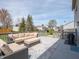 Relaxing outdoor deck with ample seating, rug, and grill, perfect for entertaining at 270 Lazy Hollow Dr, Brownsburg, IN 46112