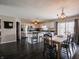 Open dining area adjacent to the kitchen, featuring a modern chandelier and backyard views at 270 Lazy Hollow Dr, Brownsburg, IN 46112