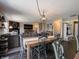 Open concept dining table and view into the spacious living room at 270 Lazy Hollow Dr, Brownsburg, IN 46112