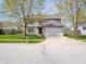 Charming two-story home with a two-car garage and a well-maintained front yard and fresh driveway at 270 Lazy Hollow Dr, Brownsburg, IN 46112
