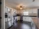 Bright kitchen with white cabinets, stainless appliances and countertops at 270 Lazy Hollow Dr, Brownsburg, IN 46112