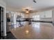 Modern kitchen features an island with bar seating, stainless appliances and dark countertops at 270 Lazy Hollow Dr, Brownsburg, IN 46112