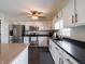 Bright kitchen with white cabinets, stainless appliances, and ample counter space at 270 Lazy Hollow Dr, Brownsburg, IN 46112