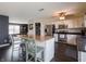 Open kitchen with an island, stainless appliances, and eat in bar at 270 Lazy Hollow Dr, Brownsburg, IN 46112