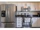 Stainless steel appliances, white cabinets, and modern fixtures in this kitchen at 270 Lazy Hollow Dr, Brownsburg, IN 46112