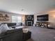 Cozy living room with a fireplace, TV, and comfortable sectional sofa at 270 Lazy Hollow Dr, Brownsburg, IN 46112