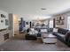 Open-concept living room showcasing a large sectional sofa and seamless transition to the kitchen at 270 Lazy Hollow Dr, Brownsburg, IN 46112