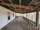 Large back deck offers great outdoor views and features sturdy wooden railings at 2975 High Rock Dr, Martinsville, IN 46151