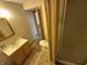 Modest bathroom featuring a vanity, toilet, and shower with neutral-toned walls at 2975 High Rock Dr, Martinsville, IN 46151