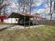 Carport featuring vehicle parking with metal frame and clear overhead view at 2975 High Rock Dr, Martinsville, IN 46151