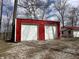 Red metal garage featuring two white garage doors at 2975 High Rock Dr, Martinsville, IN 46151