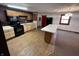 Updated kitchen with black appliances, a breakfast bar, and a mix of carpet and wood-look vinyl floors at 2975 High Rock Dr, Martinsville, IN 46151