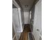 Hallway featuring wood floors and traditional white trim throughout the home at 3101 N Temple Ave, Indianapolis, IN 46218