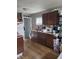 Functional kitchen features wood floors, ample cabinet storage, and a convenient sink at 3101 N Temple Ave, Indianapolis, IN 46218