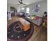 Spacious living room offers wood floors, a ceiling fan, and comfortable seating arrangements at 3101 N Temple Ave, Indianapolis, IN 46218