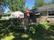 Spacious backyard deck with mature landscaping surrounding the outdoor living space at 3155 W 57Th St, Indianapolis, IN 46228