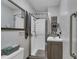Clean bathroom with a standup shower, decorative mirror, and modern vanity at 3155 W 57Th St, Indianapolis, IN 46228