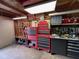 Organized garage space with tool storage, work bench, and ample lighting at 3155 W 57Th St, Indianapolis, IN 46228