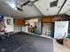 Well-lit garage area featuring utility appliances and convenient storage capabilities at 3155 W 57Th St, Indianapolis, IN 46228