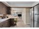 Spacious kitchen leading to breakfast area with a stainless steel fridge at 3155 W 57Th St, Indianapolis, IN 46228