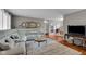 Comfortable living room featuring hardwood floors, a couch, and natural light at 3155 W 57Th St, Indianapolis, IN 46228