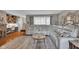 Open concept living room with hardwood floors, natural lighting, and comfortable seating at 3155 W 57Th St, Indianapolis, IN 46228