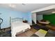 Finished basement with blue walls, a bed, and patchwork carpeting at 3316 Gainesville Ct, Indianapolis, IN 46227