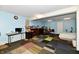 Finished basement with blue walls, a bed, desk, and patchwork carpeting at 3316 Gainesville Ct, Indianapolis, IN 46227