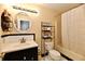 Clean bathroom featuring a vanity, toilet, bathtub with a shower curtain at 3316 Gainesville Ct, Indianapolis, IN 46227