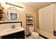 Clean bathroom featuring a vanity, toilet, bathtub with a shower curtain at 3316 Gainesville Ct, Indianapolis, IN 46227