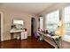 Bright bedroom featuring a makeup vanity, modern desk, hardwood floors, and natural light at 3316 Gainesville Ct, Indianapolis, IN 46227