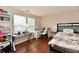 Bedroom with modern desk, shelving and a double bed with floral bedding at 3316 Gainesville Ct, Indianapolis, IN 46227